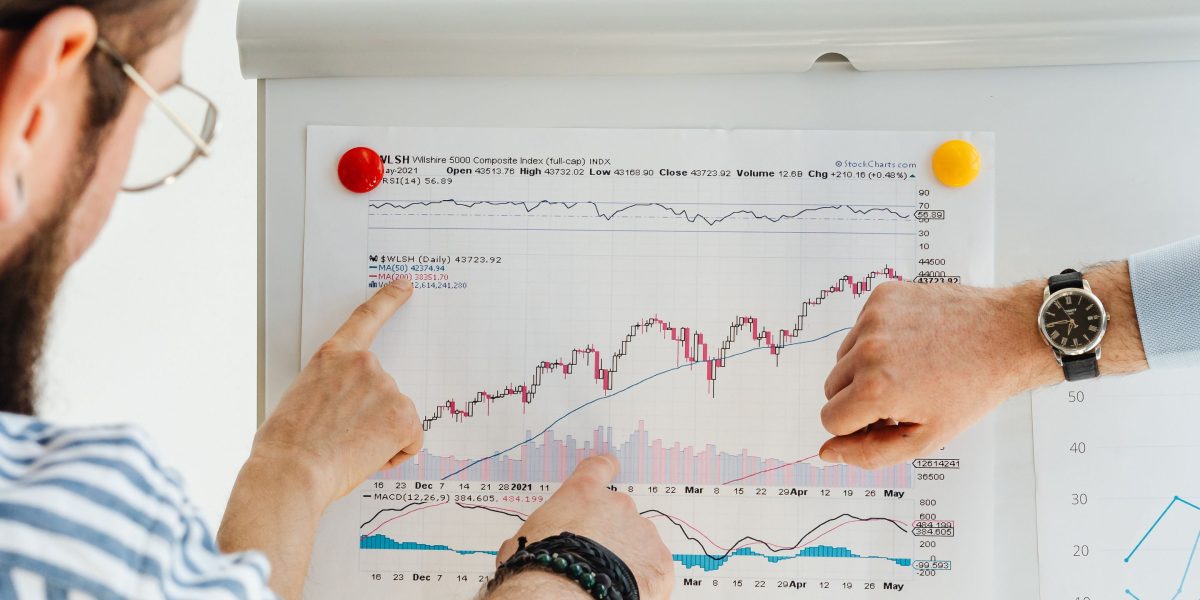 Professionals collaborating to analyze market trends, reflecting the growing demand in probate law.