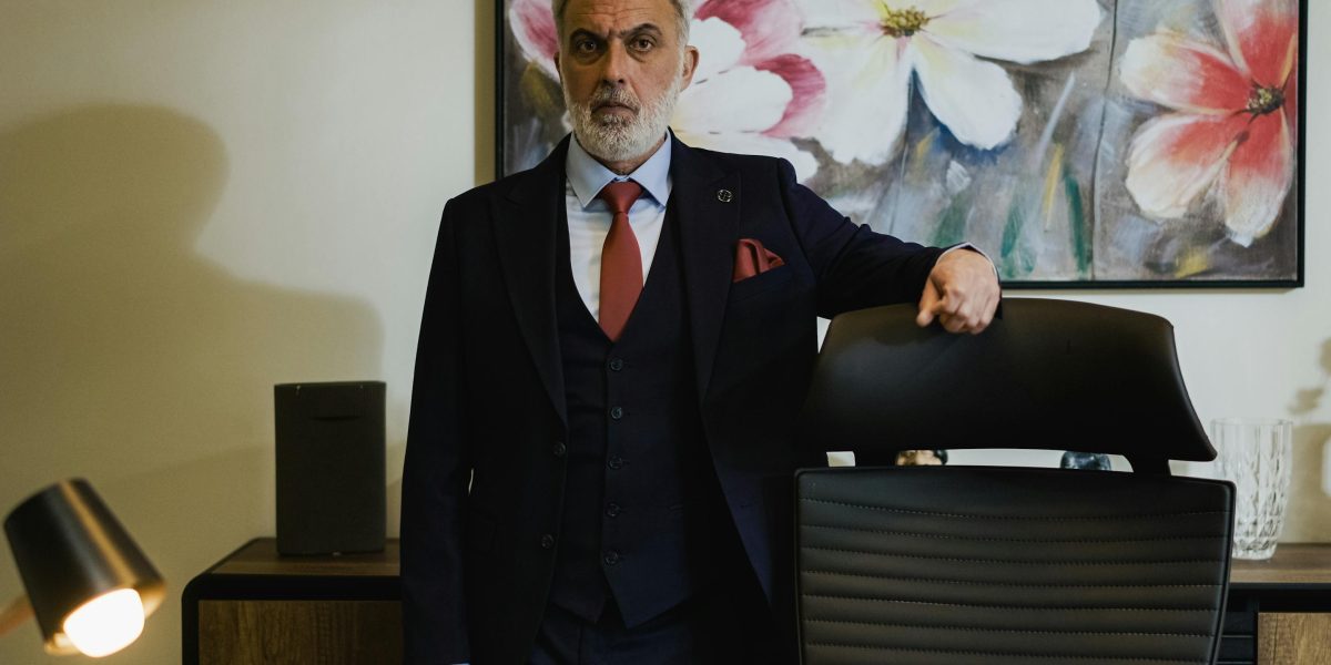 A confident business professional in a modern office, representing the efficiency and success brought by adopting legal technology.
