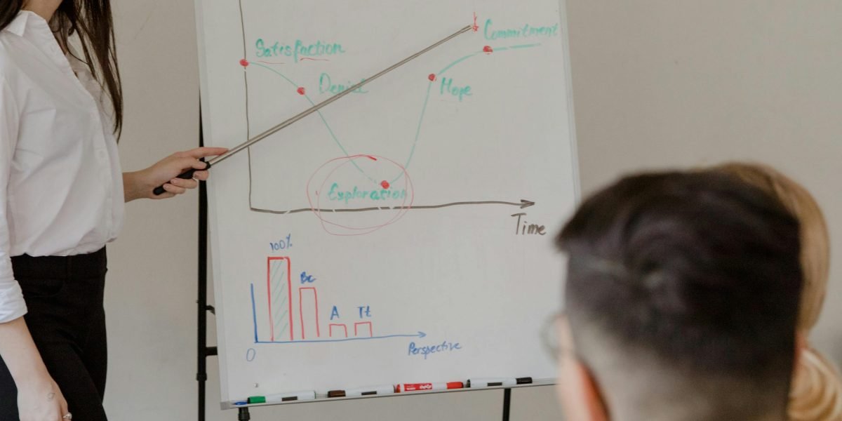 A senior legal professional provides guidance to a junior colleague, illustrating the importance of mentorship and learning from experienced figures.