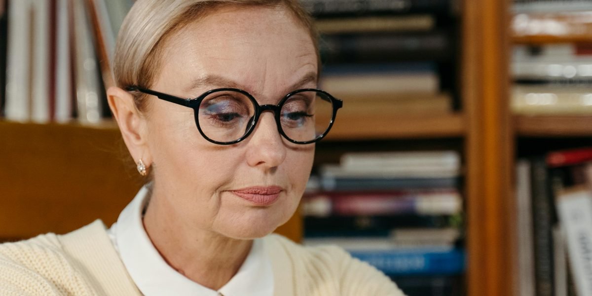 A professional diligently researching documents, emphasizing the thoroughness required for fact-checking and building trustworthy attorney profiles.
