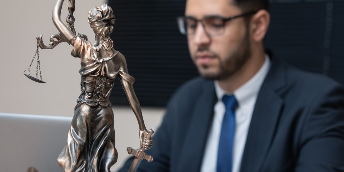 A professional lawyer smiling confidently, conveying trustworthiness and approachability for their online profile.