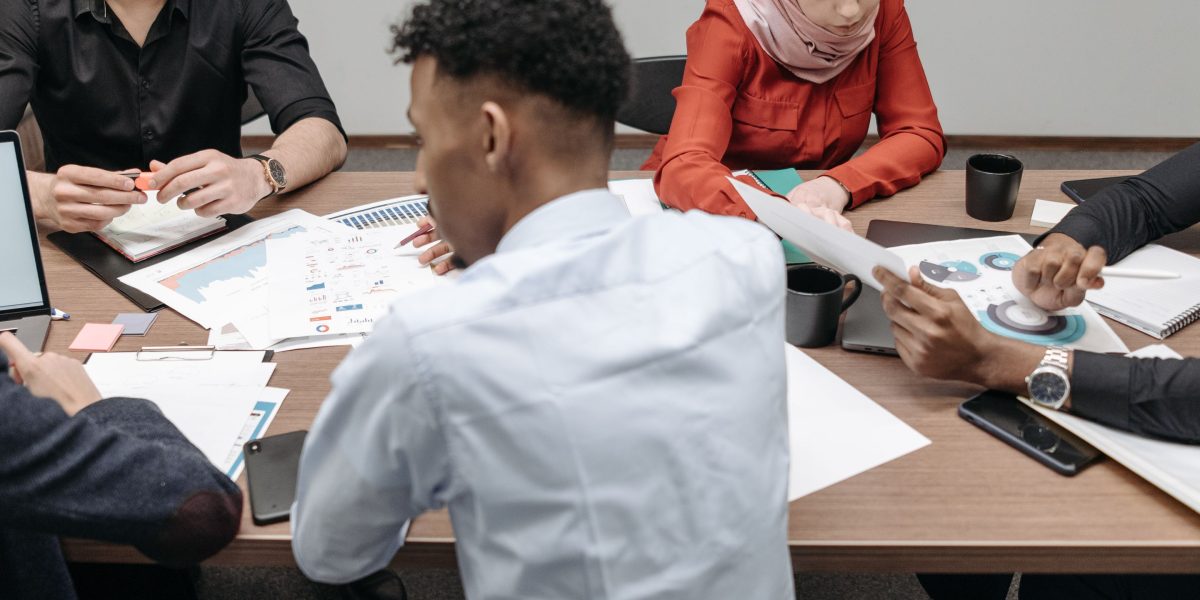 Diverse professionals in a virtual or physical meeting, emphasizing international collaboration and harmonizing practices.