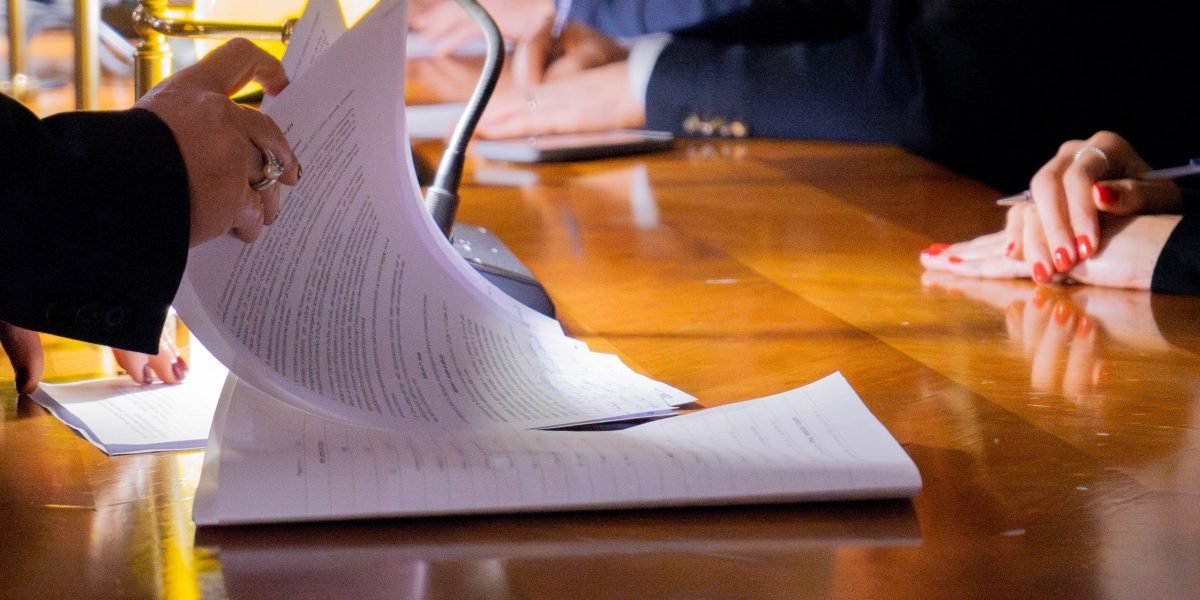 Professionals collaborating in a meeting, using data to inform strategic legal decisions and stay competitive.