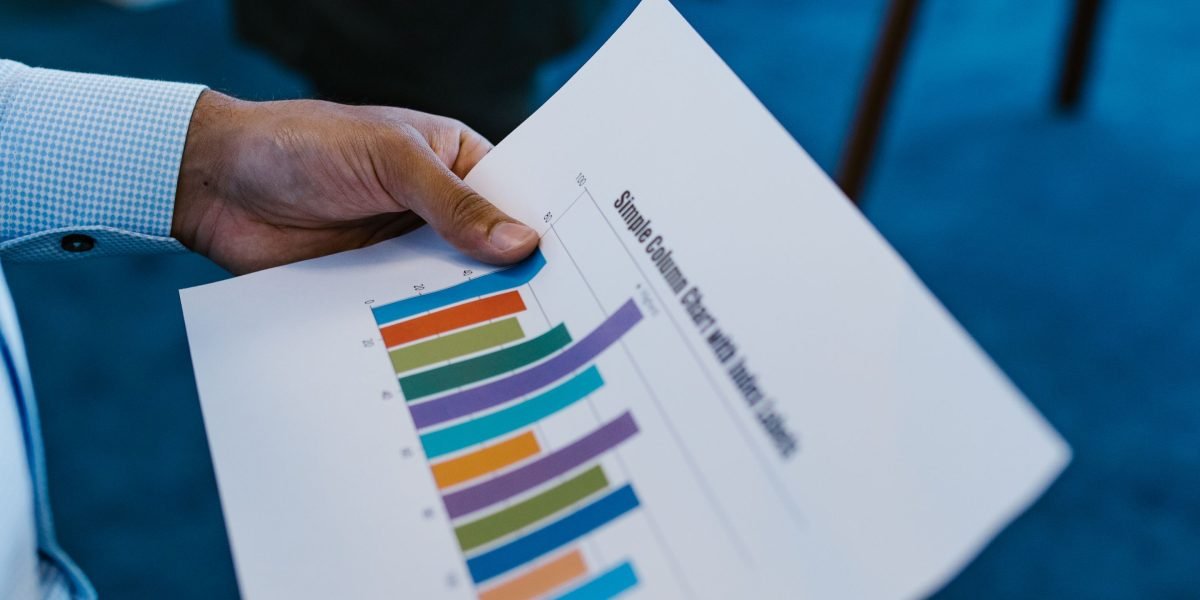 A legal professional carefully reviews business reports, symbolizing the use of AmLaw 200 data for informed decision-making.