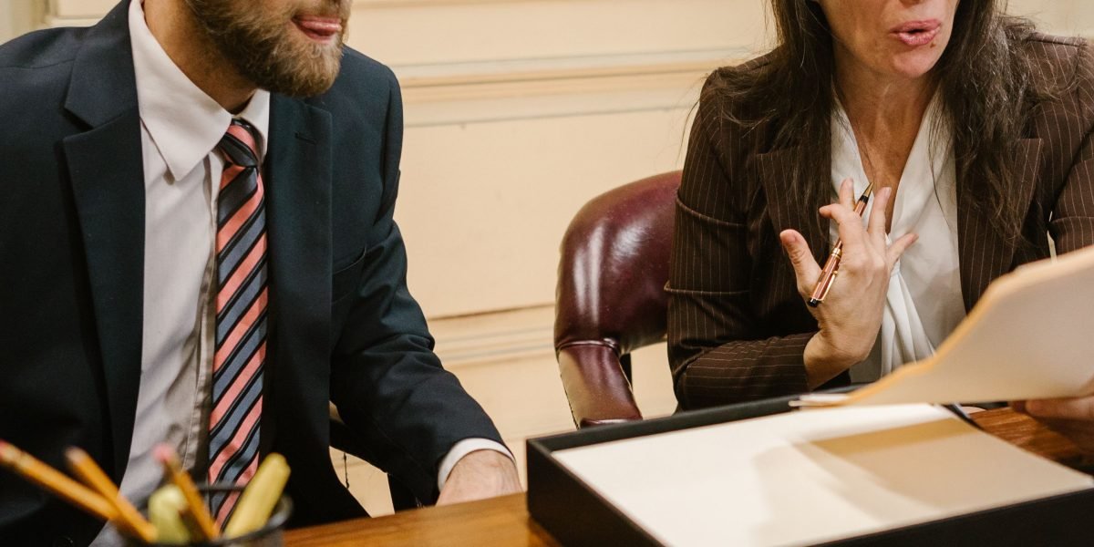 A legal team meticulously reviewing compliance documents, emphasizing the importance of ethical and secure online practices for law firms.