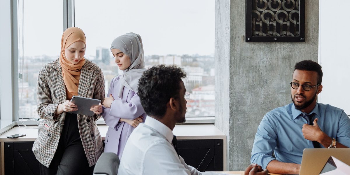A diverse team collaborating to map out strategies for various business dispute scenarios.