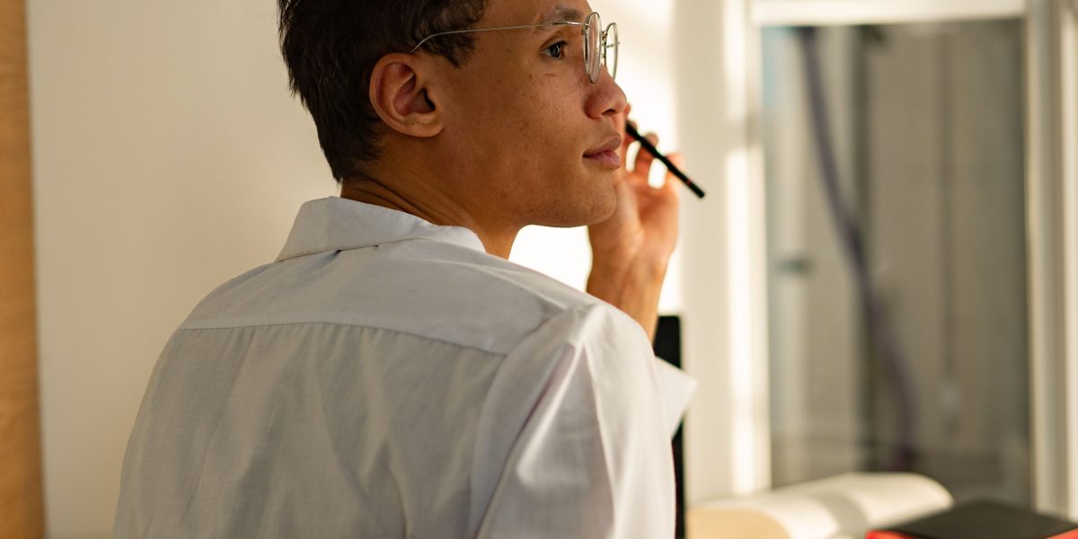 A professional making a critical decision about legal strategy, weighing internal versus external resources.