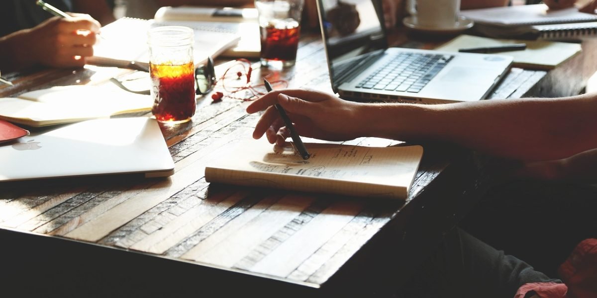 A corporate lawyer providing strategic legal advice to a business client in a modern office setting.