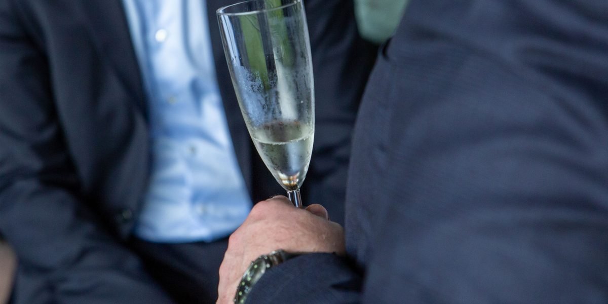 Legal professionals engaging in conversation at a networking event, fostering connections and sharing insights.