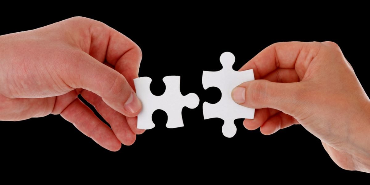 A group of professionals collaboratively mapping out a workflow or solving a complex technical challenge.