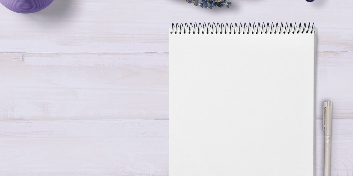 A person writes on a whiteboard, creating a checklist, representing the systematic evaluation process for selecting a law firm.