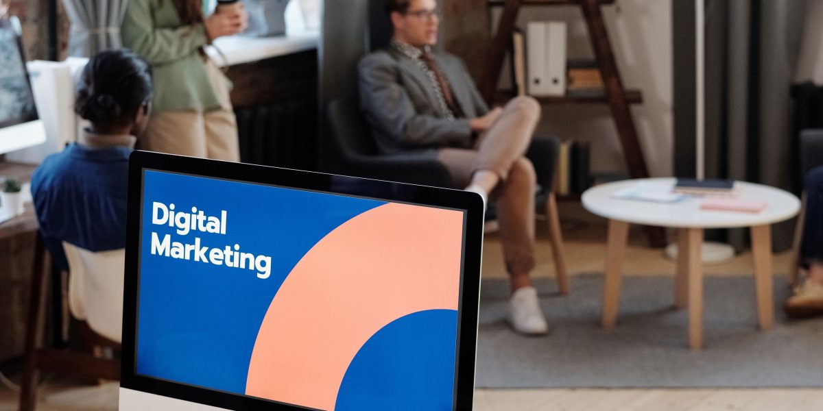 Professionals brainstorm and evaluate various digital marketing channels to optimize reach.