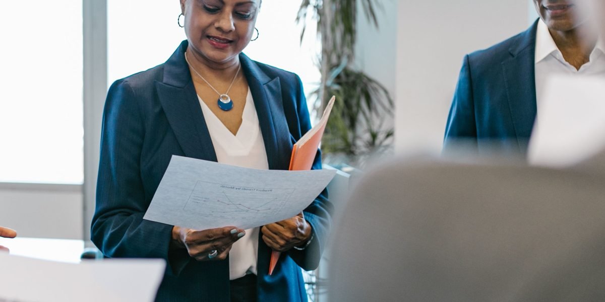 Business leaders evaluating complex legal frameworks in a collaborative setting.