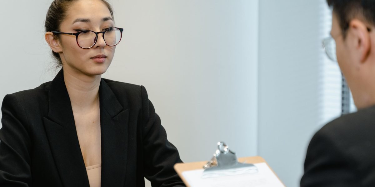A professional conducts an interview, assessing a candidate's suitability for a key role.