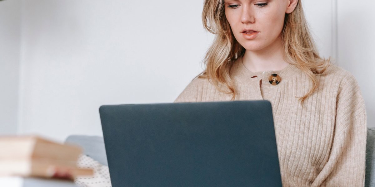 A person diligently researching various law firms online, navigating complex information to find the right legal match.