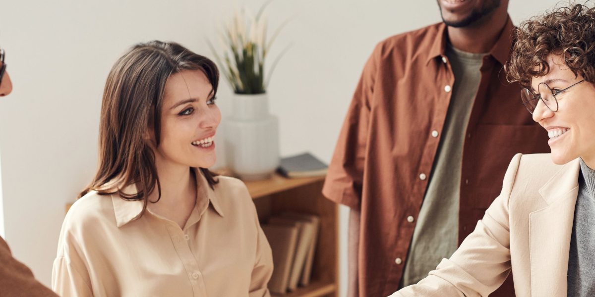 Two professionals shaking hands, symbolizing the successful conclusion of a legal partnership or client engagement.