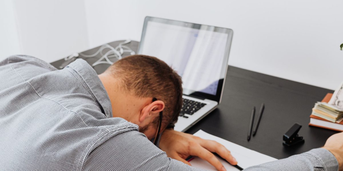 A person looking thoughtful or slightly overwhelmed, surrounded by numerous documents or information sources, symbolizing the challenge of information overload.