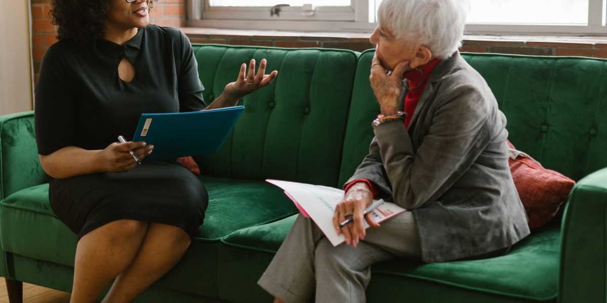 A person receiving guidance from a mentor, illustrating the benefit of leveraging local resources for business growth.