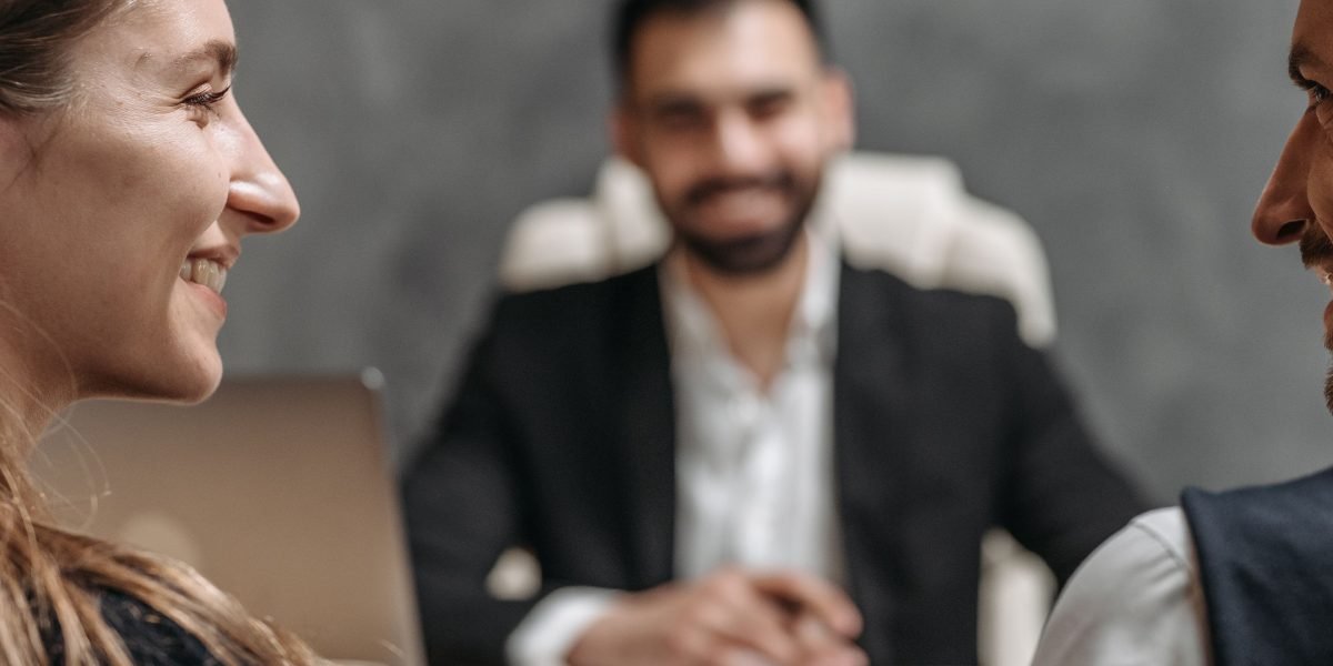 A legal professional meeting with a satisfied client, demonstrating modern service delivery.